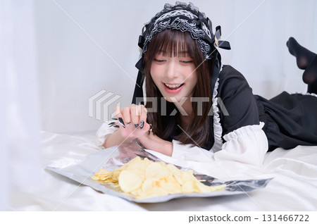 A landmine girl eating potato chips A landmine girl eating potato chips 131466722