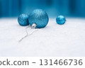 Blue Christmas Baubles On Snow With Festive Blue Background And Copy Space 131466736
