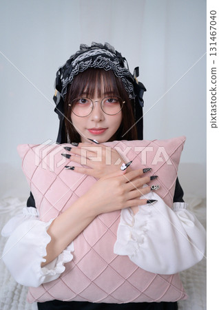 A landmine girl holding a cushion 131467040