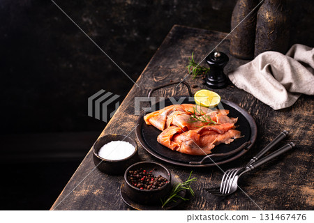 Salted sliced salmon fish with herbs 131467476
