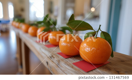 Lucky oranges with green leaves arranged for festive cultural celebration Lucky oranges with green leaves arranged for festive cultural celebration 131467569
