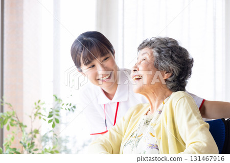 Wheelchair senior and caregiver 131467916