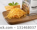 Heap of shredded cheddar cheese close-up. 131468037