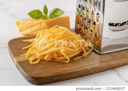 Heap of shredded cheddar cheese close-up. 131468037