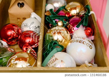 A set of gold, red and white Christmas tree balls with inscriptions A set of gold, red and white Christmas tree balls with inscriptions 131468186