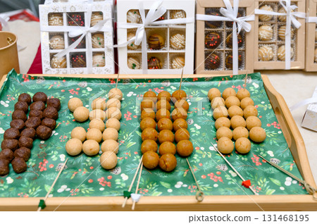 Colorful candy balls on a wooden tray Colorful candy balls on a wooden tray 131468195