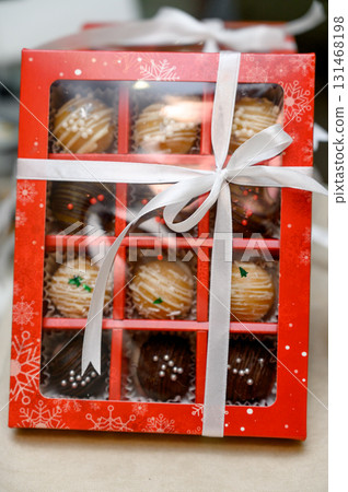 A selection of handmade chocolates in gift boxes 131468198