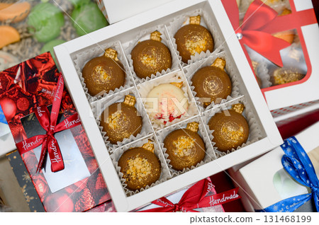 A selection of handmade chocolates in gift boxes A selection of handmade chocolates in gift boxes 131468199