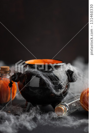 Halloween Cauldron with Pumpkins, Spiders and Cobwebs 131468330