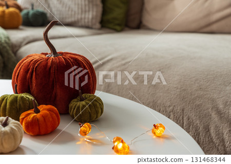 Cozy Autumn Home Decor with Pumpkins and Seasonal Textiles Cozy Autumn Home Decor with Pumpkins and Seasonal Textiles 131468344
