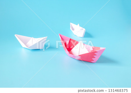 Leadership concept.Group of origami boats on blue. Leadership concept.Group of origami boats on blue. 131468375