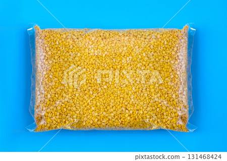 A peeled split mung bean in bag on background. Top view. 131468424