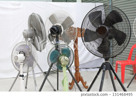 Metal fan blowing cold air in storage shed. Metal fan blowing cold air in storage shed. 131468495