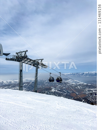 Gondola lift cabins at Amirsoy ski resort, Uzbekistan. Winter landscape 131469156