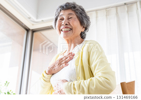 Senior woman with hand on chest 131469166