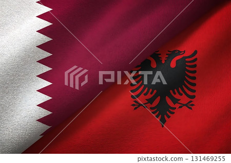 A close up view of the flags of qatar and albania displayed side by side in a studio 131469255