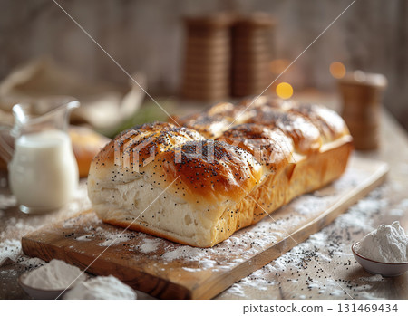 Golden buttery buns brown loaf bread with poppy seeds placed on wooden board soft morning light, showing freshness homemade 131469434