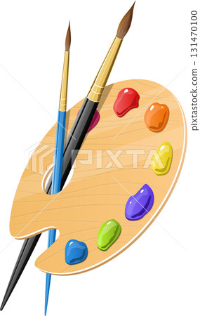 A wooden artist's palette with dabs of various paint colors and two paintbrushes lying beside it. 131470100
