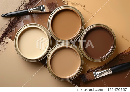 Paint cans and brushes forming a palette of brown and beige colors 131470767
