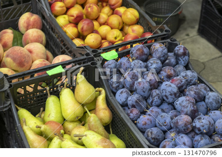 Fig fruits, pears, plums and other fruits and berries on display of the farmers stall Fig fruits, pears, plums and other fruits and berries on display of the farmers stall 131470796