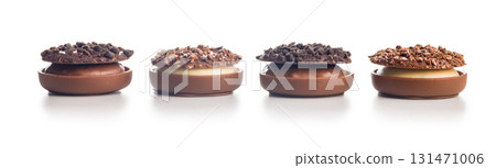 Sweet chocolate pralines. Chocolate candies isolated on white background. 131471006