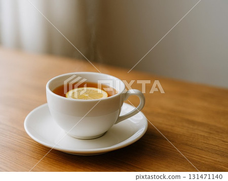 Hot tea cup with lemon on a wooden table 131471140