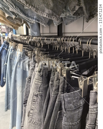 Stylish denim collection displayed in a modern retail store during daylight Stylish denim collection displayed in a modern retail store during daylight 131471234