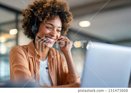 Customer support specialist engaging with clients in a modern office setting 131471608