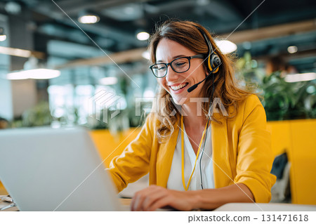 Service agent assists clients in vibrant coworking space during daytime Service agent assists clients in vibrant coworking space during daytime 131471618