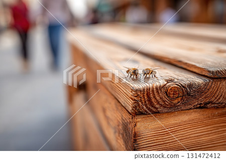 Coffee cup resting on wooden table with sunglasses and book in bright outdoor setting Coffee cup resting on wooden table with sunglasses and book in bright outdoor setting 131472412