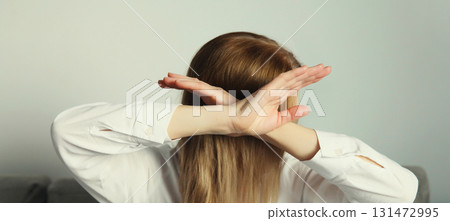 Woman shows stop, no or enough sign with palm of hand, refusal gesture, domestic violence Woman shows stop, no or enough sign with palm of hand, refusal gesture, domestic violence 131472995