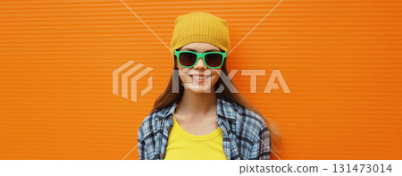 Happy modern stylish young woman, cool girl smiles in colorful trendy clothes, yellow hat Happy modern stylish young woman, cool girl smiles in colorful trendy clothes, yellow hat 131473014