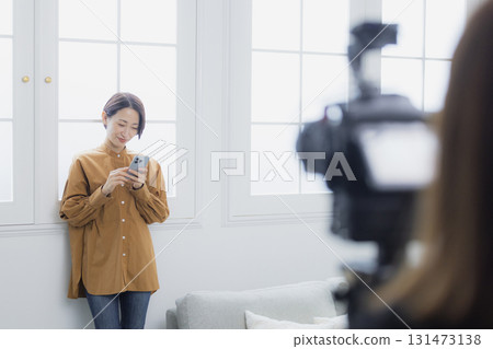 Women shooting video Women shooting video 131473138