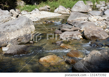 River flowing between rocks 131473392