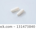 Simple background photo of white capsule pills 131473840