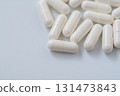 Simple background photo of white capsule pills 131473843