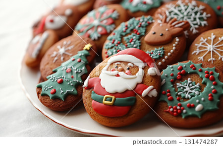 Christmas cookies Santa, trees, snowflakes, and gift shapes decorated with festive icing and sprinkles 131474287