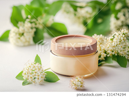 Natural rustic honey jar with hexagonal texture glows linden blossom, wooden spoon lying on table with spoonful acacia flowers , emphasizing theme homemade and organic skin care Natural rustic honey jar with hexagonal texture glows linden blossom, wooden spoon lying on table with spoonful acacia flowers , emphasizing theme homemade and organic skin care 131474294