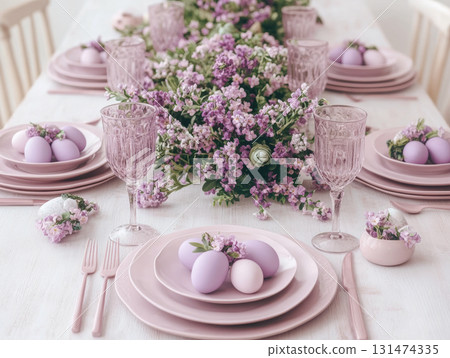 Light Minimal purple speckled Easter eggs with ceramic tableware and cherry blossoms on white linen table for top view, flat lay fresh spring decor concept. 131474335