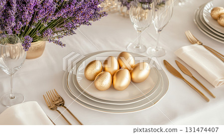 Luxury Happy Easter. Elegant top view, layout, minimalist style, Easter decorated table with golden eggs and lavender bouquet 131474407