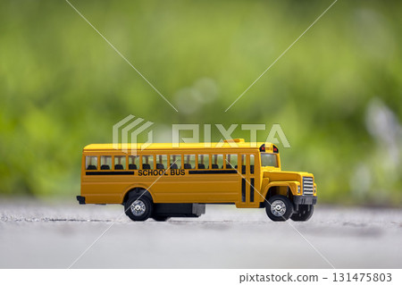 Toy american yellow school bus as symbol of education in the USA 131475803