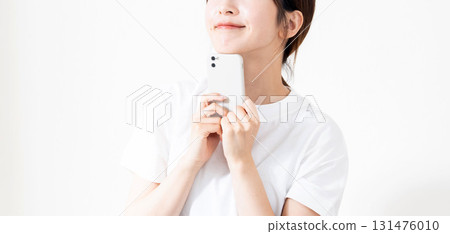 A woman using a smartphone 131476010