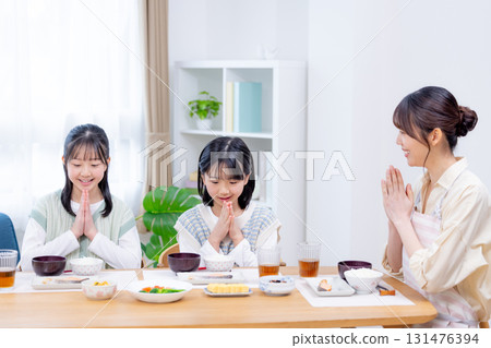 Family breakfast girl eating rice 131476394