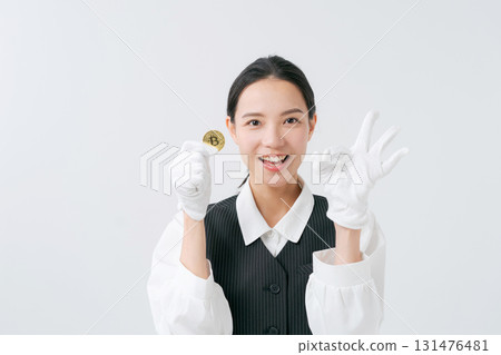 A woman appraising precious metals A woman appraising precious metals 131476481