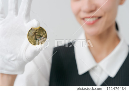 A woman appraising precious metals A woman appraising precious metals 131476484