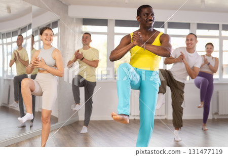 Middle-aged Afro-American man practicing active dance in training hall 131477119