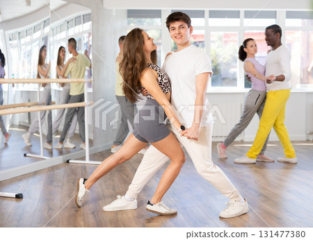 Young man and woman dancing latin dances 131477380