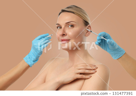 Woman is undergoing a cosmetic procedure at a clinic Woman is undergoing a cosmetic procedure at a clinic 131477391