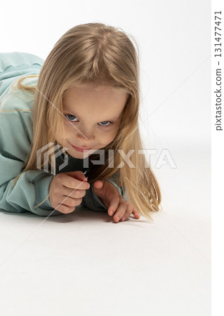 Portrait of beautiful cute little toddler girl. Child with funny face. Pretty smile kid in studio on white background. High quality photo 131477471