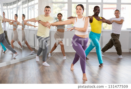 Young Asian woman practicing active dance in training hall 131477509